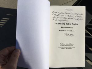 An autographed copy of Mastering Table Topics.